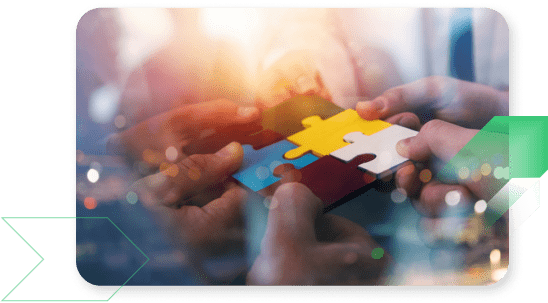 Group of people working together on a jigsaw puzzle.